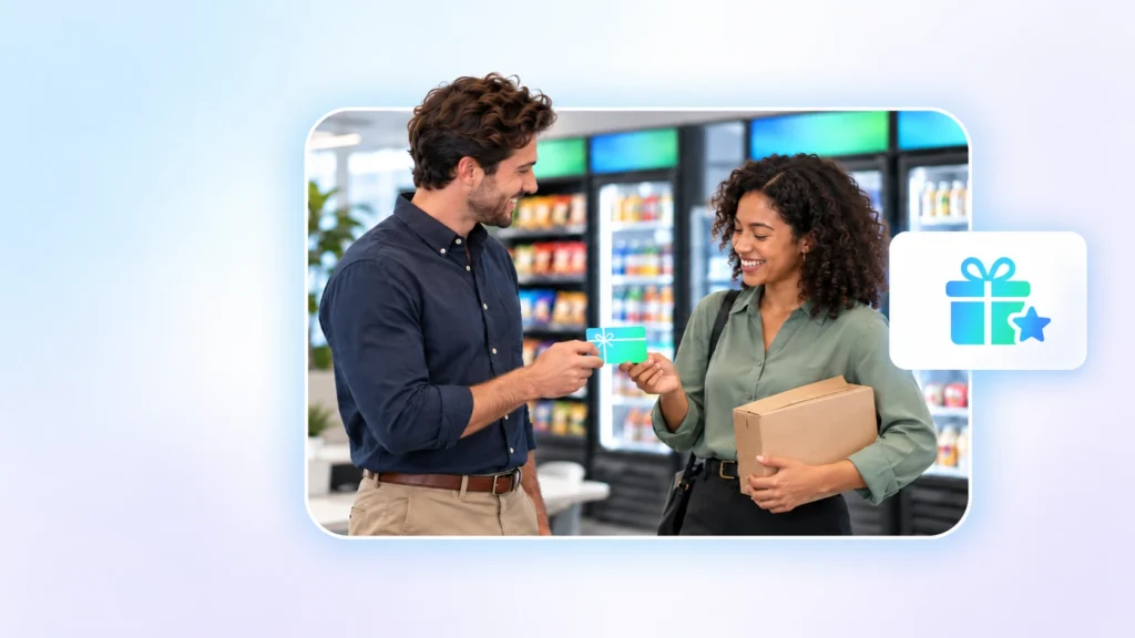 Two smiling coworkers with a meal bag and a reward card in a workplace breakroom market